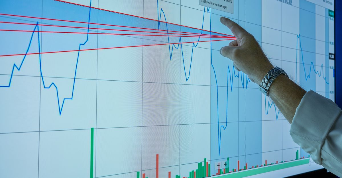 Closeup of hand analyzing financial graph on a digital screen for market trends and investment insights.